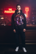 Male model wearing The Daily Dead Freddy and Jason Last Call hoodie