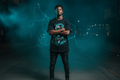 Black male model wearing The Daily Dead Pennywise Darkside tee