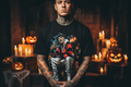 Male model wearing The Daily Dead Freddy Pumpkin Patch tee