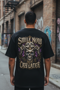 Male model wearing the Smile Now Cry Later tee
