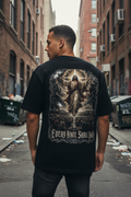 Male model wearing the Every Knee Shall Bow tee