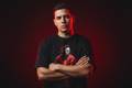 Hispanic male model wearing The Daily Dead Michael Myers Killer in Red tee