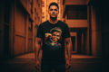 Hispanic male model wearing The Daily Dead Chucky Still Playin tee