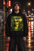 Male model wearing an oversized black Nirvana hoodie with the yellow-green Kurt portrait artwork