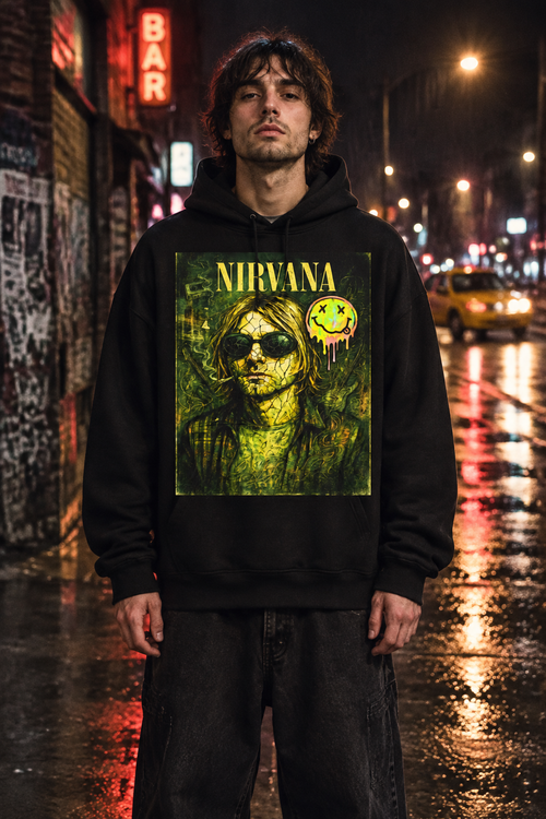 Male model wearing an oversized black Nirvana hoodie with the yellow-green Kurt portrait artwork